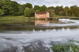 Early morning view across River Stour to Sturminster Newton Mill in Dorset.