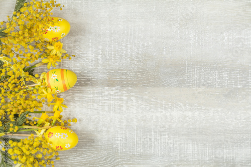 Easter holiday composition in yellow colors with spring flowers.