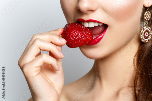 beautiful girl with fresh strawberries