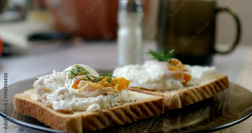 A man put poached eggs on crispy toast A man put poached eggs on crispy toast
