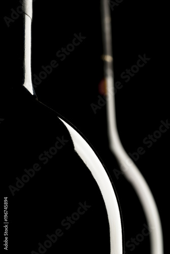 Silhouette of wine bottle, black background, two bottles of wine photo