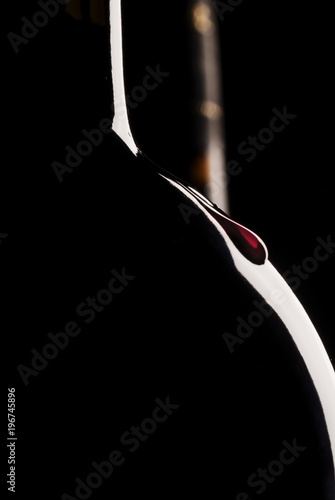 Silhouette of wine bottle, black background, two wine bottles, vertical, wine drop photo
