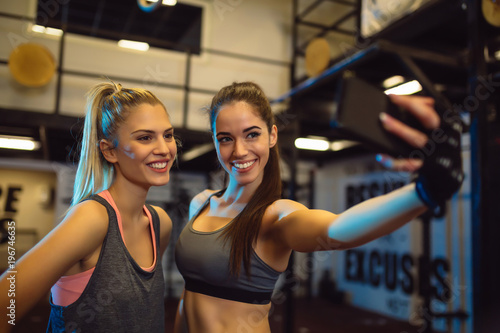Portrait of young women taking a selfie in the gym. © Nebojsa