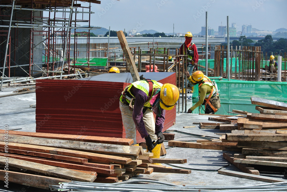 Construction workers working at the construction site during the ...