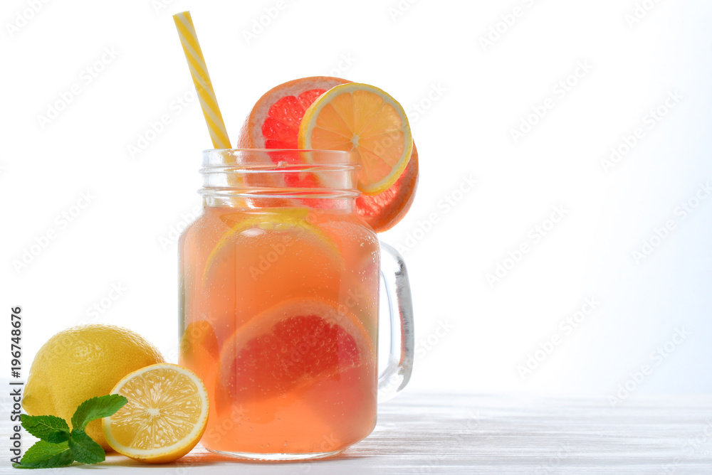Fototapeta premium Ice refreshing summer drink with lots of different fruits. Space for text or design