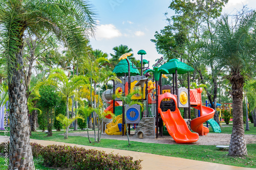 colorful public playground and many green tree in the park © reshoot