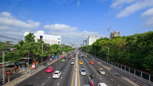 4k Time-lapse of traffic on Ngamwongwan Road at Kasetsart University in bangkok, Thailand photo