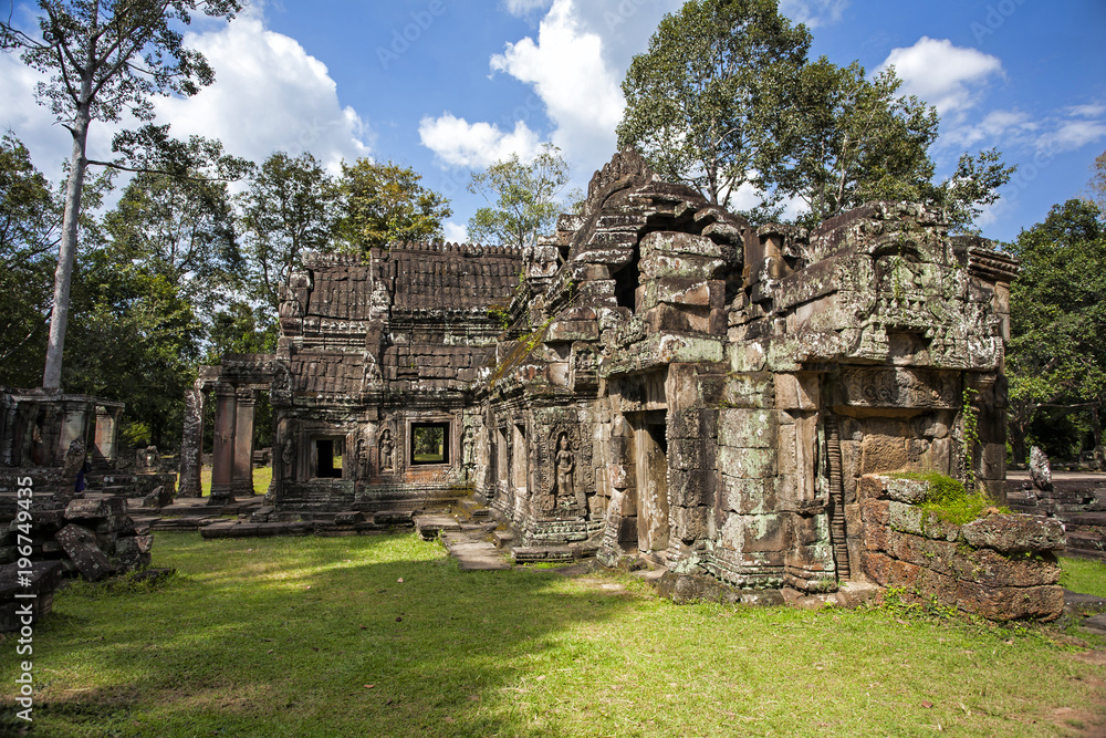 Angkor Wat - one of the temples in the khmer complex with trees and roots over the temple walls  in Siem Reap, Cambodia