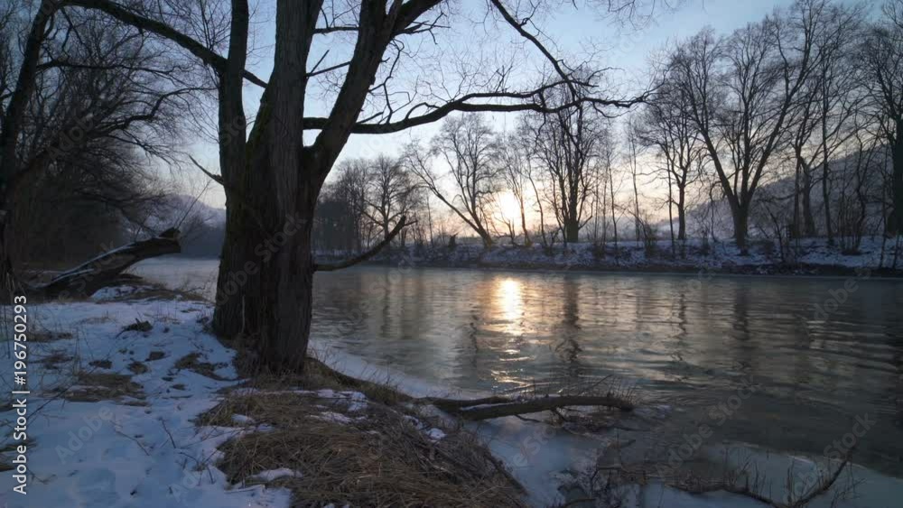 Calm morning with sunrise over trees on the river bank Dolly shot Calm morning with sunrise over trees on the river bank Dolly shot