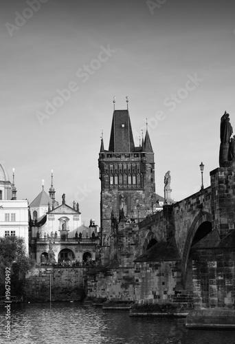 Black-and-white photograph of the Charles bridge. Prague's historical center, photo from the river.