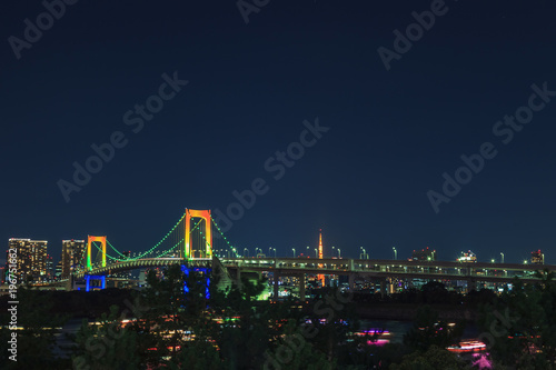 View of Tokyo Bay, Rainbow bridge and Tokyo Tower landmark, Night scene, Odaiba, Japan