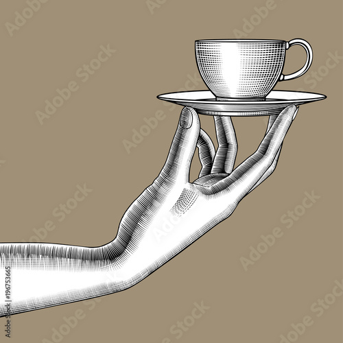 Woman's hand with a coffee cup