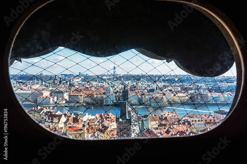 Charles bridge and Zizkov television tower from St. Nicholas bell tower, Prague photo