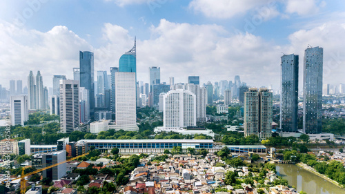 Panoramic view of Jakarta cityscape with residential houses, modern office and apartment buildings
