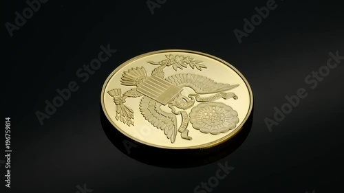 Rotating bitcoin cryptocurrency gold eagle logo black backround e-commerce photo