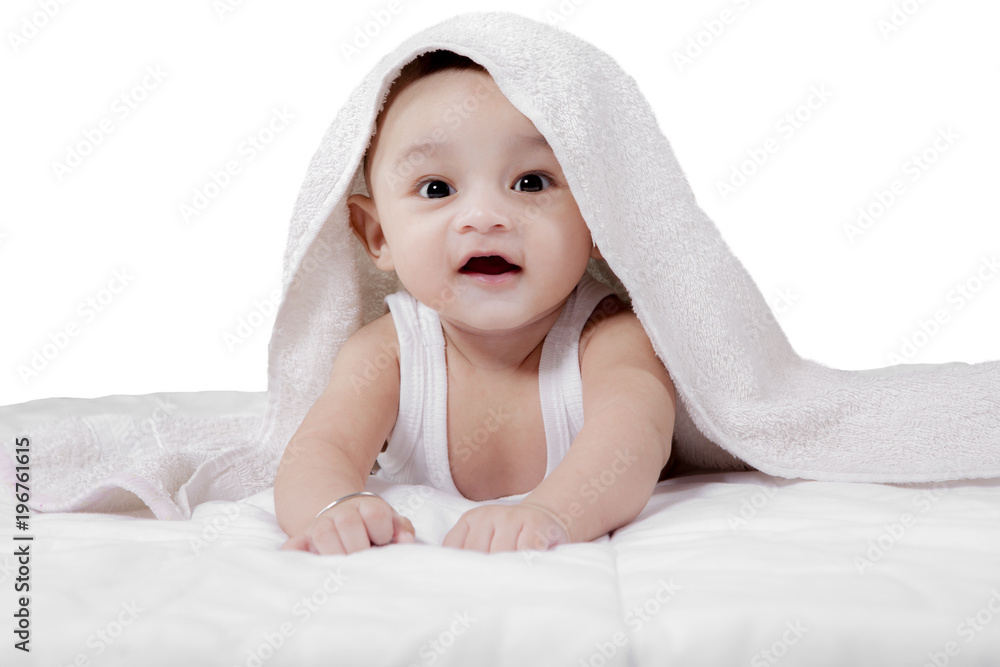 Adorable baby boy crawling under a towel Adorable baby boy crawling under a towel