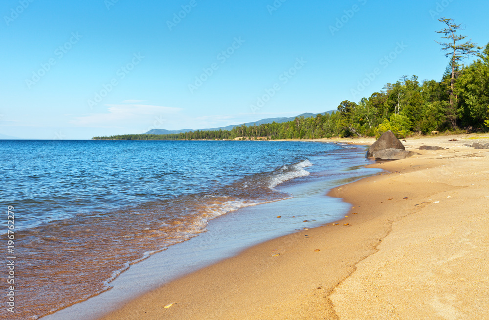 Lake Baikal in the summer. Beautiful sandy beaches on the east coast in the sunny afternoon