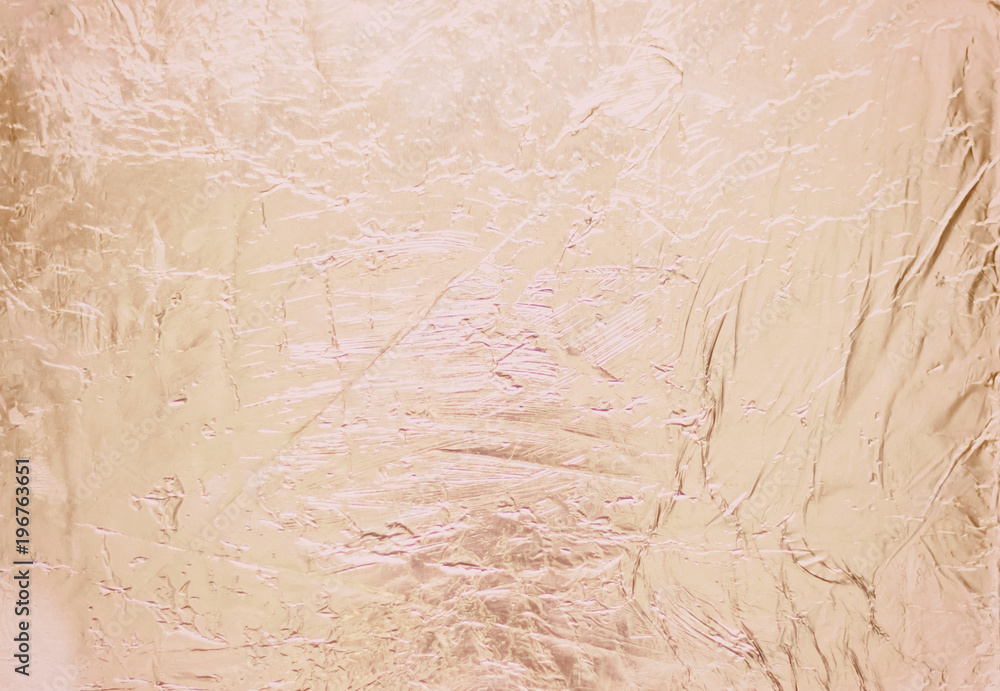 Fototapeta premium Silver foil background with shiny crumpled surface for texture background.