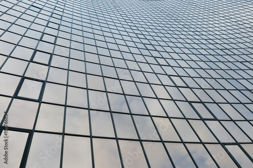 Glass surface of skyscrapers view in district of business centers with reflection on it  black and white