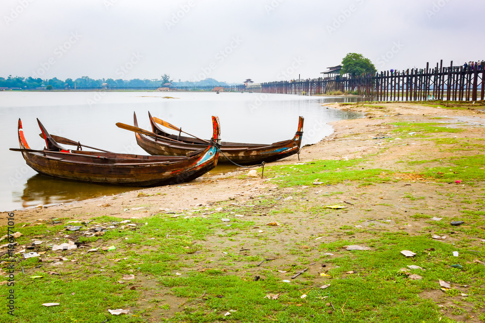 Wooden boats at the famous Ubeng Bridge in Mandalay