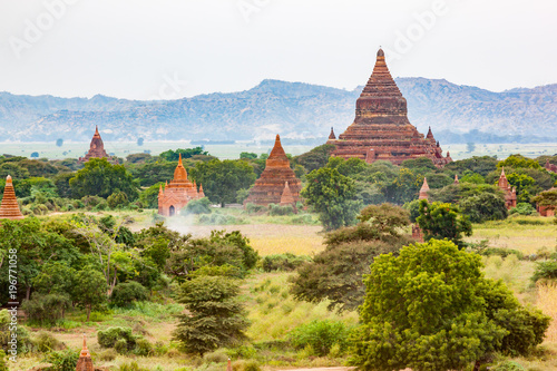 View of ancient buddhist temple and pagoda in the Plain of Bagan