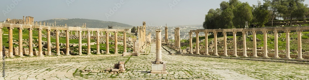 wall from old antique columns in Jerash city in Jordan