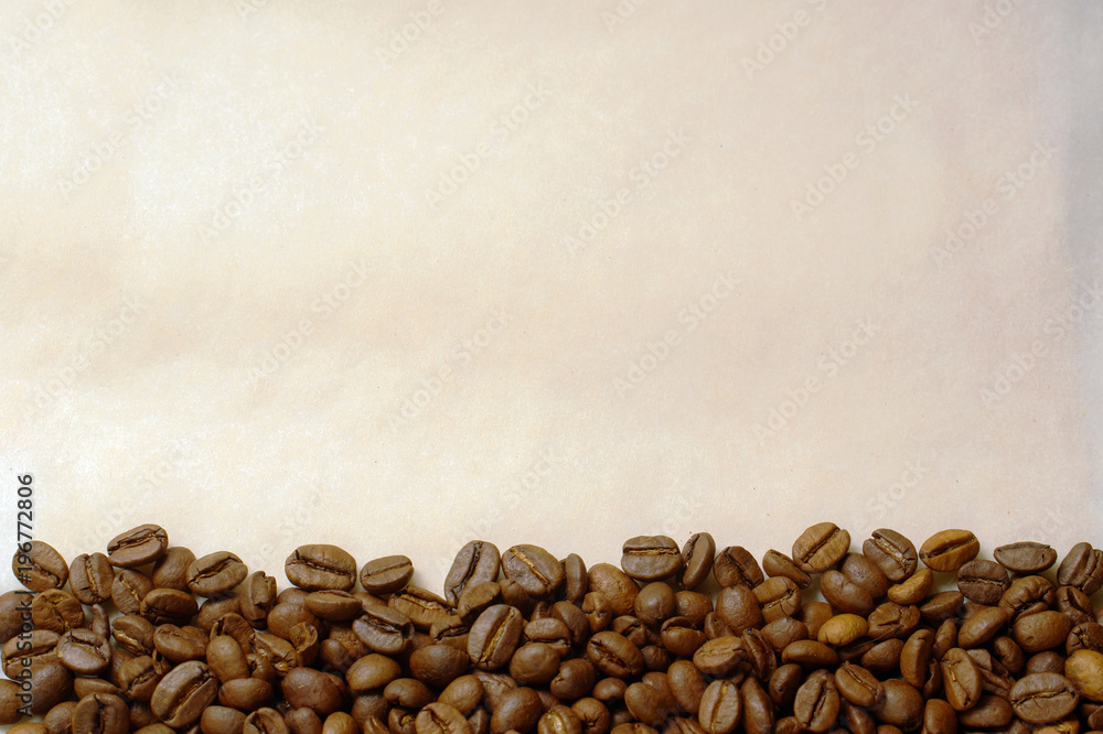 Coffee beans on old burnt paper background