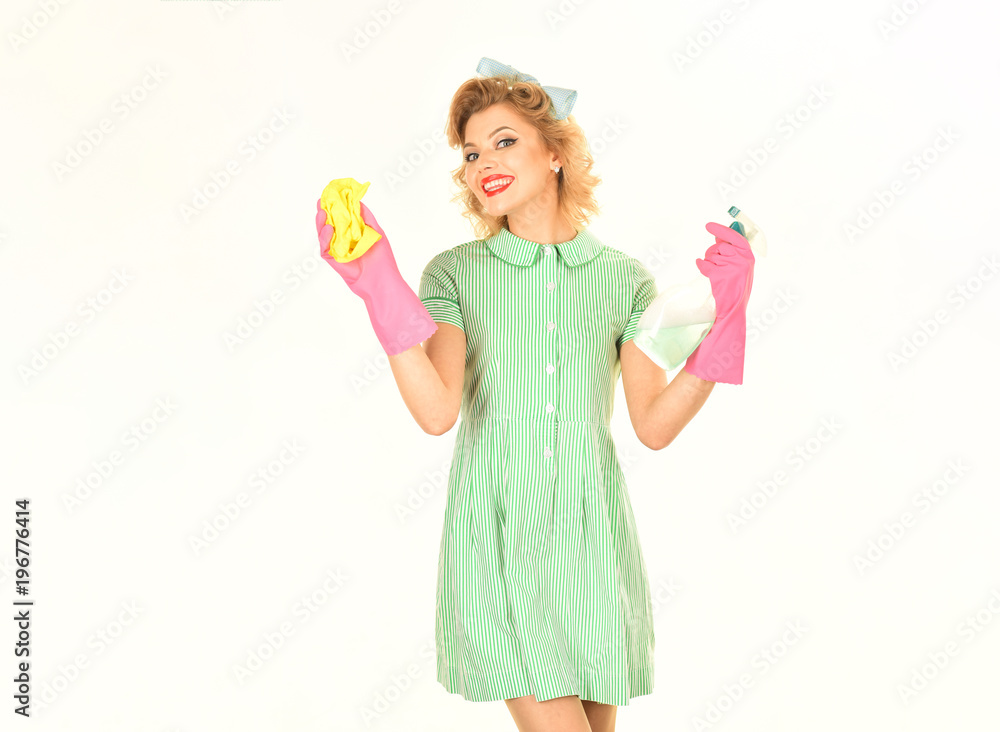 Housekeeper in uniform with clean spray, duster. Housekeeper in uniform with clean spray, duster.