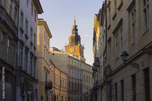 view on Bracka street and city hall in background, Krakow, Poland, warm colors