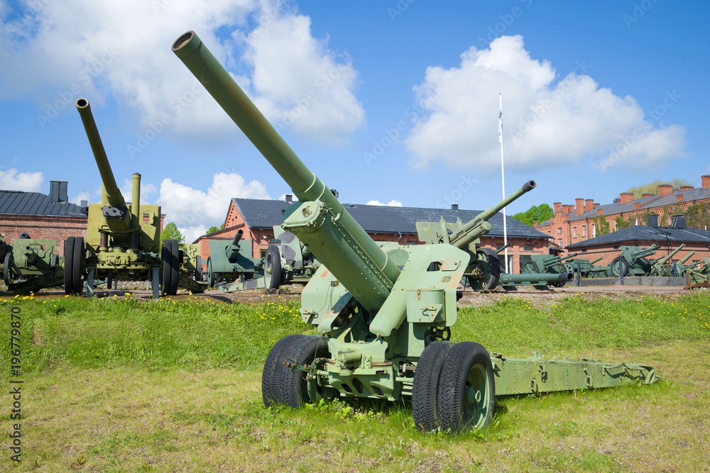 Artillery gun of the Second World War period close-up on a sunny summer day. Hameenlinna, Finland Artillery gun of the Second World War period close-up on a sunny summer day. Hameenlinna, Finland