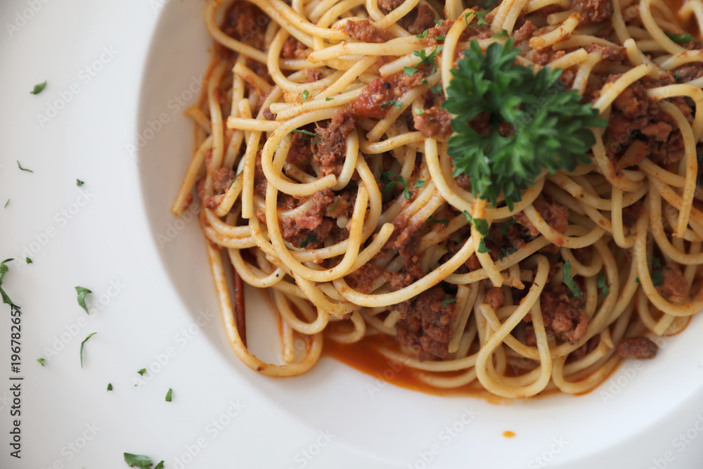 Spaghetti bolognese with beef tometo sauce on wood table , italian food Spaghetti bolognese with beef tometo sauce on wood table , italian food