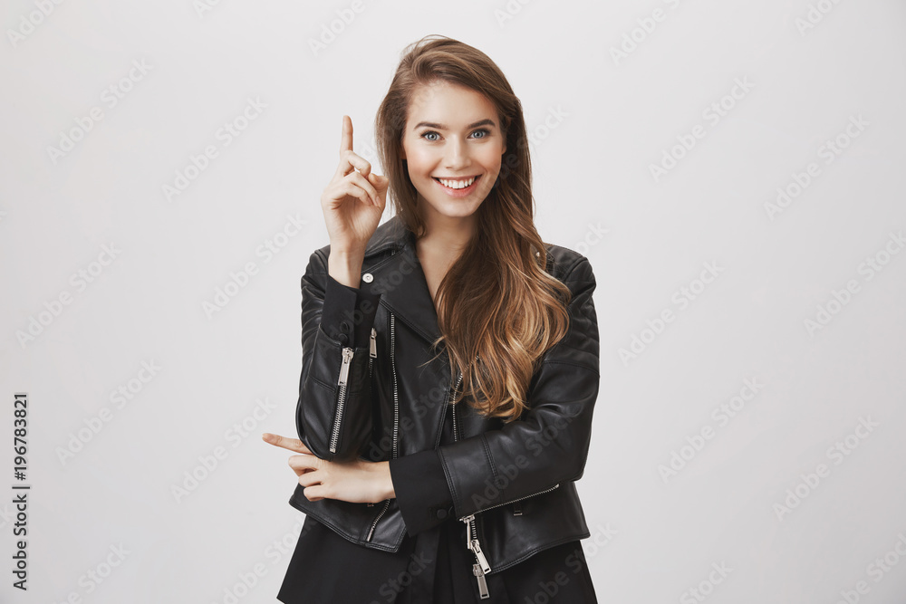 Attractive smart coworker has perfect idea for you. Portrait of beautiful caucasian woman raising index finger in eureka gesture, glancing at camera with excited expression, having suggestion Attractive smart coworker has perfect idea for you. Portrait of beautiful caucasian woman raising index finger in eureka gesture, glancing at camera with excited expression, having suggestion