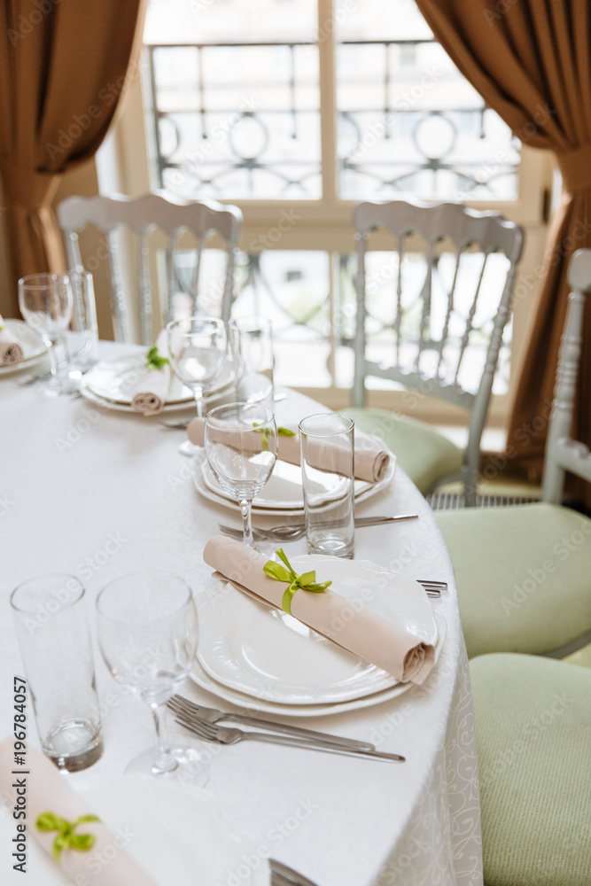 Elegant table set up for a wedding banquet or party event. Wedding table setting. Elegant table set up for a wedding banquet or party event. Wedding table setting.