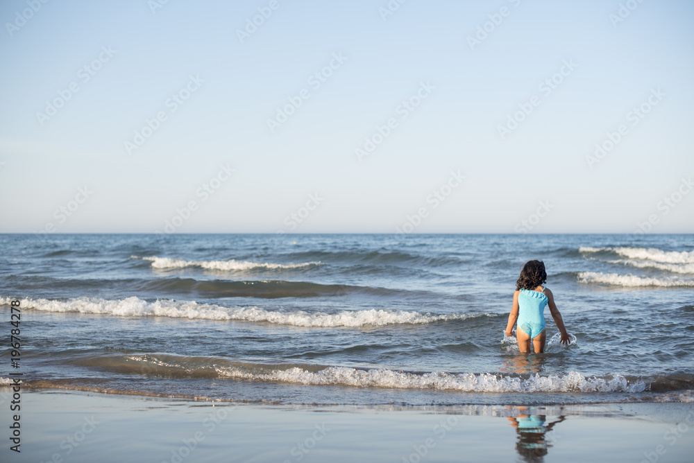 little girl vacationing on the beach