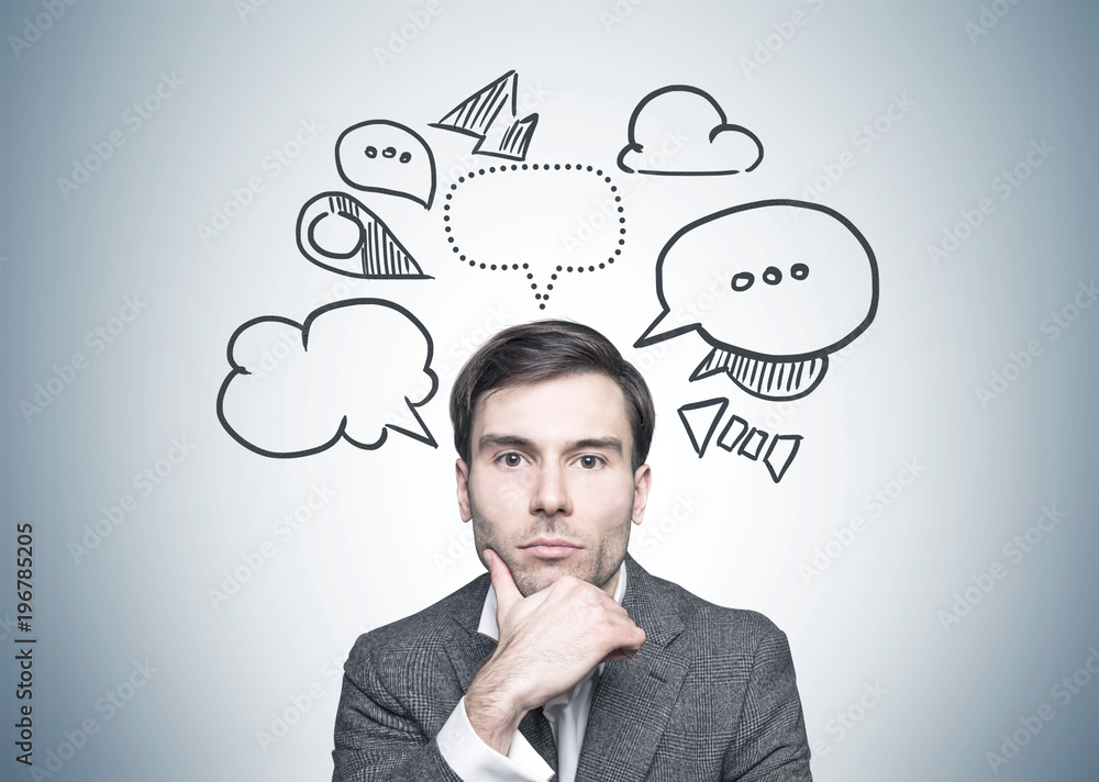 Thoughtful dark haired businessman, speech bubbles Thoughtful dark haired businessman, speech bubbles