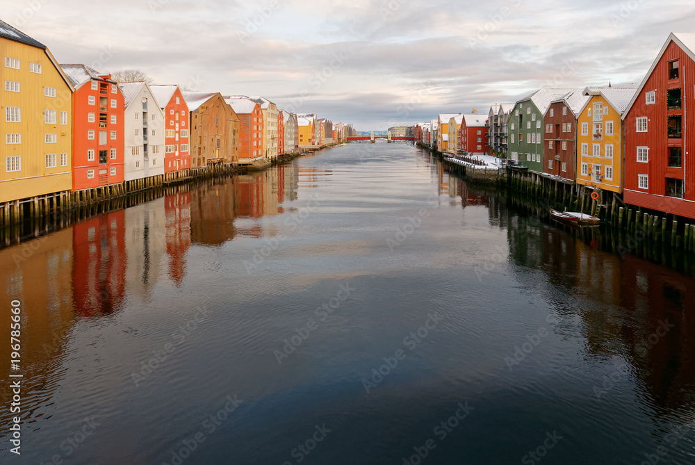 Naklejka premium Old town of Trondheim - Coloured Storehouses at the river Nidelva (winter time)