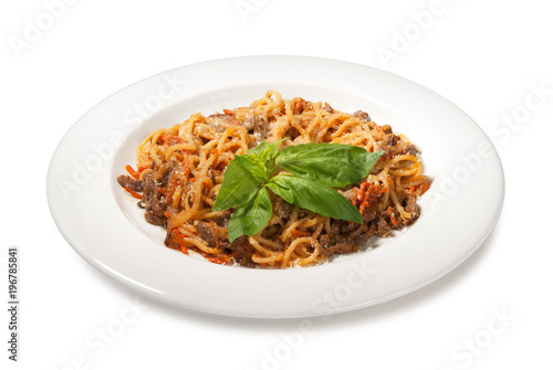 pasta with meat, carrots and basil isolated on white background