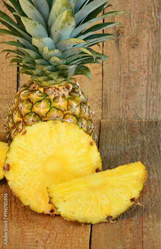 Ananas or Pineapple on wooden background