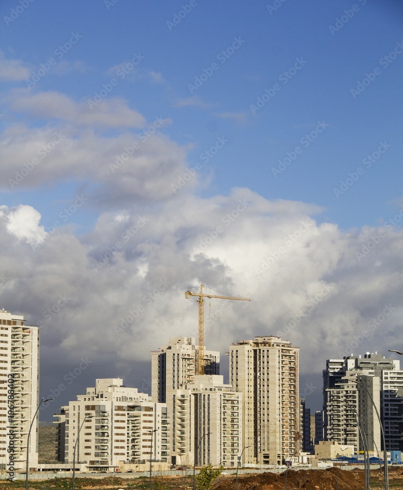 Urban high rise architecture concept. View of New Neighborhood under the blue sky Urban high rise architecture concept. View of New Neighborhood under the blue sky