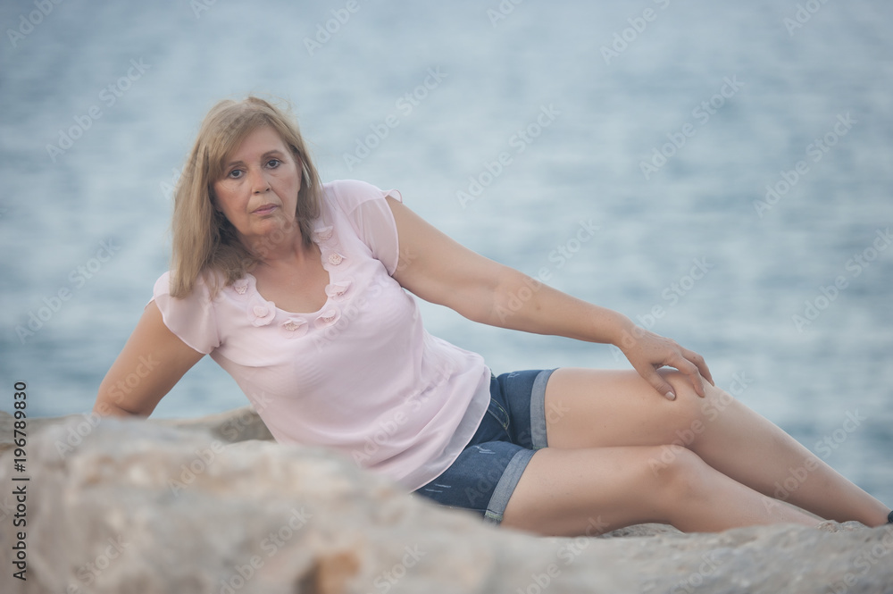 Mature woman posing on vacation