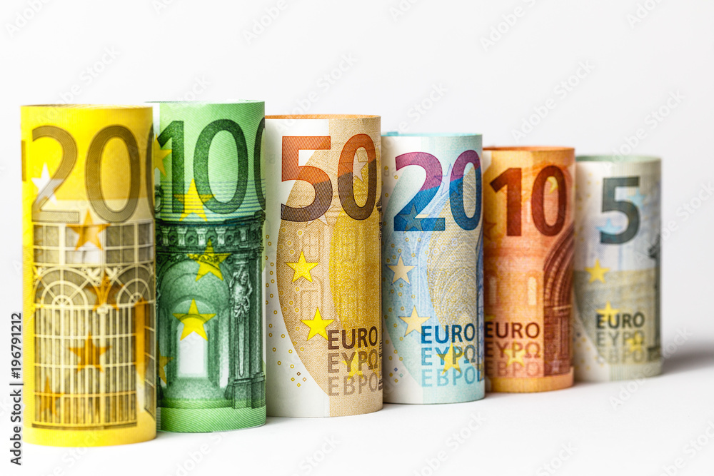 Several hundred euro banknotes stacked by value.Rolls Euro bankn Several hundred euro banknotes stacked by value.Rolls Euro bankn