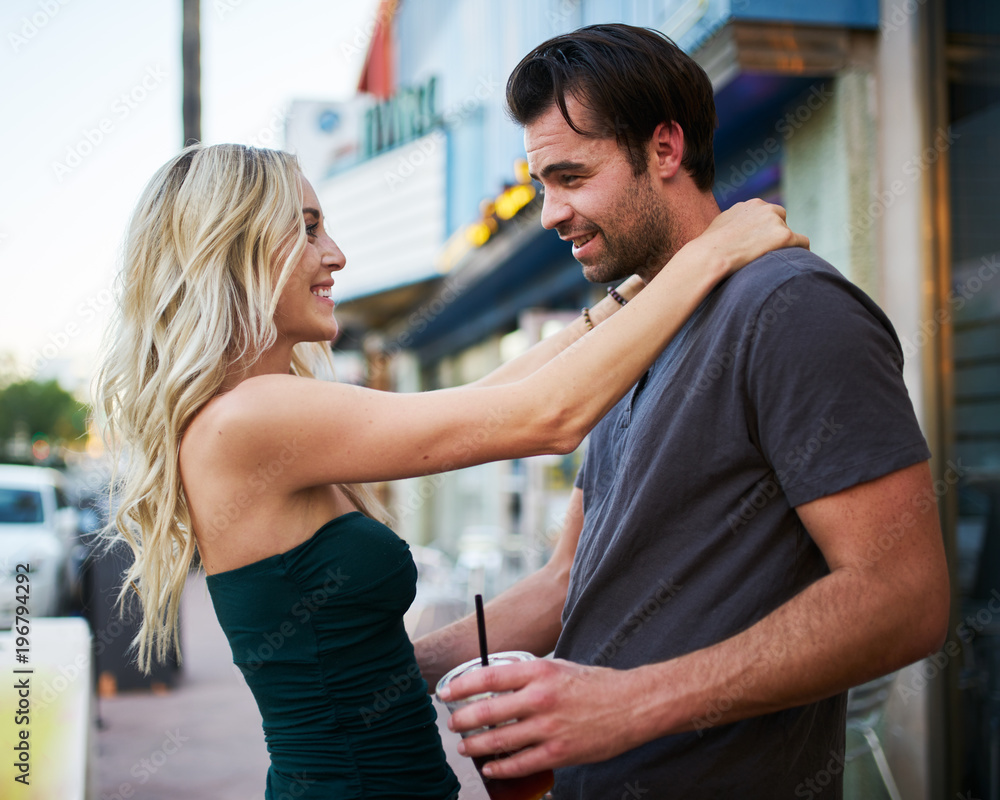 romantic couple having fun together enjoying walking through city romantic couple having fun together enjoying walking through city