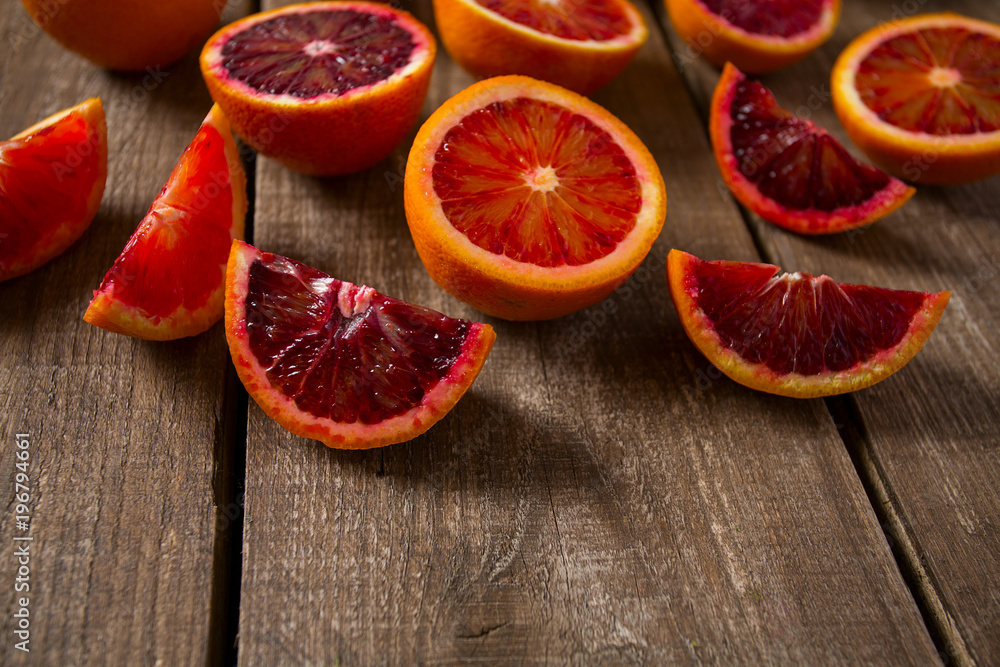 blood orange on wooden surface blood orange on wooden surface