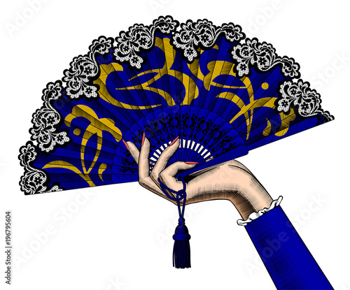 Female hand holding a blue open fan with yellow ornament isolated on white