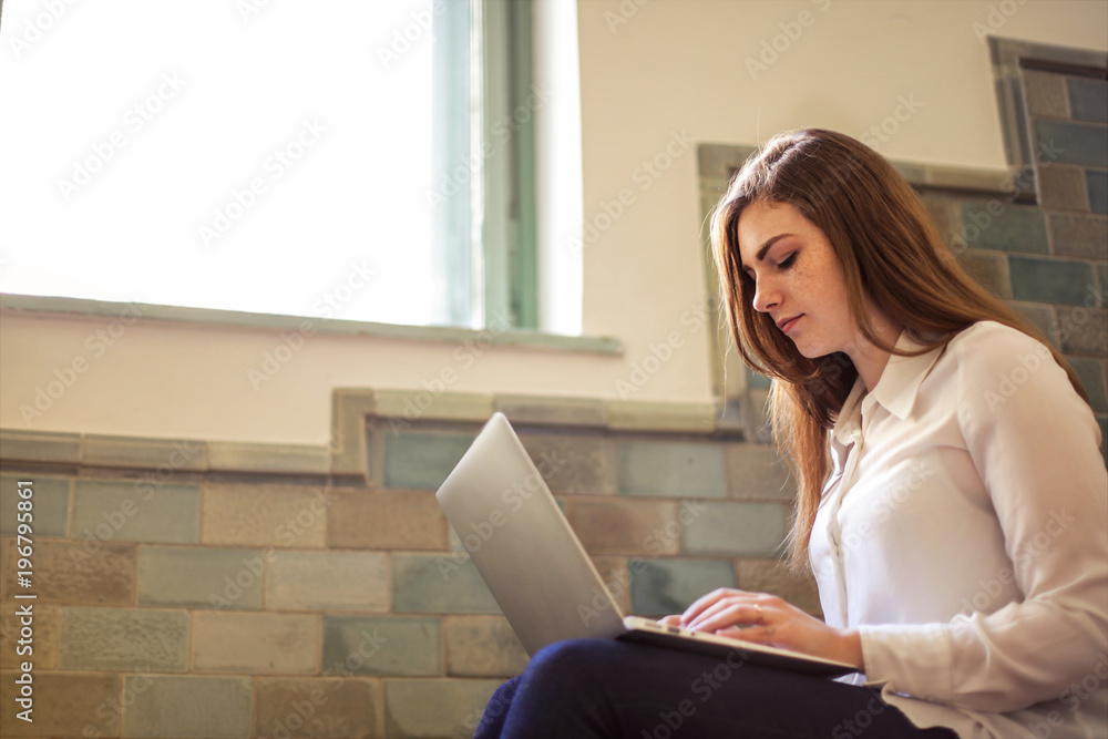 Girl using a laptop Girl using a laptop