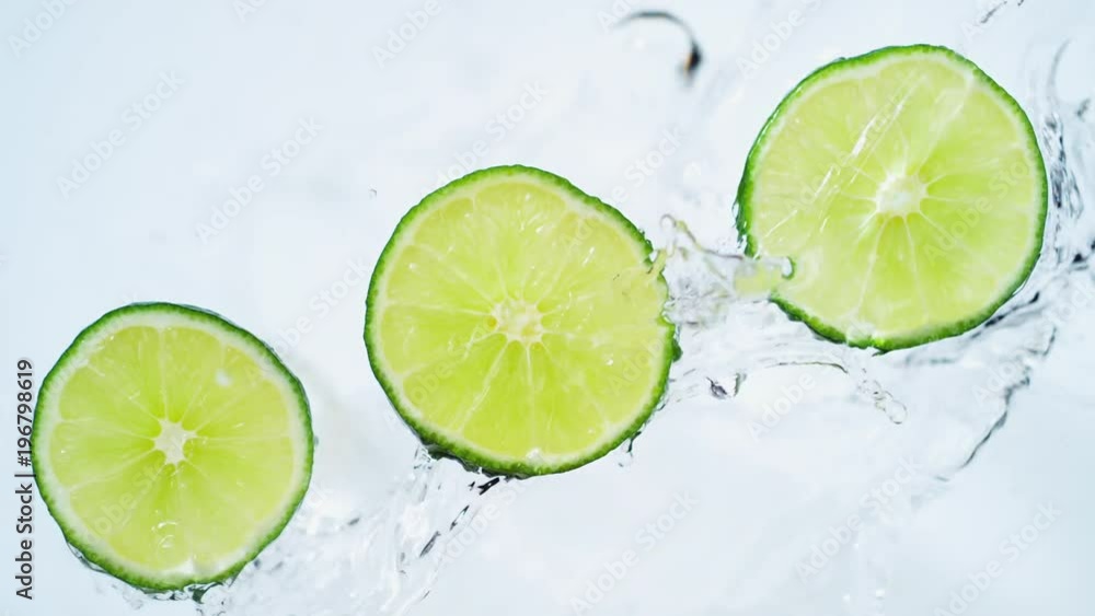 Water splash on sliced lime. Shot with high speed camera, phantom flex 4K. Slow Motion. Water splash on sliced lime. Shot with high speed camera, phantom flex 4K. Slow Motion.
