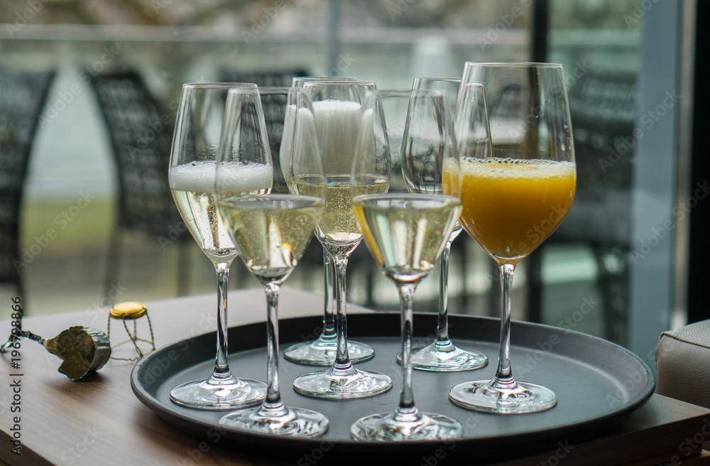 Glasses with champagne on the party table Glasses with champagne on the party table