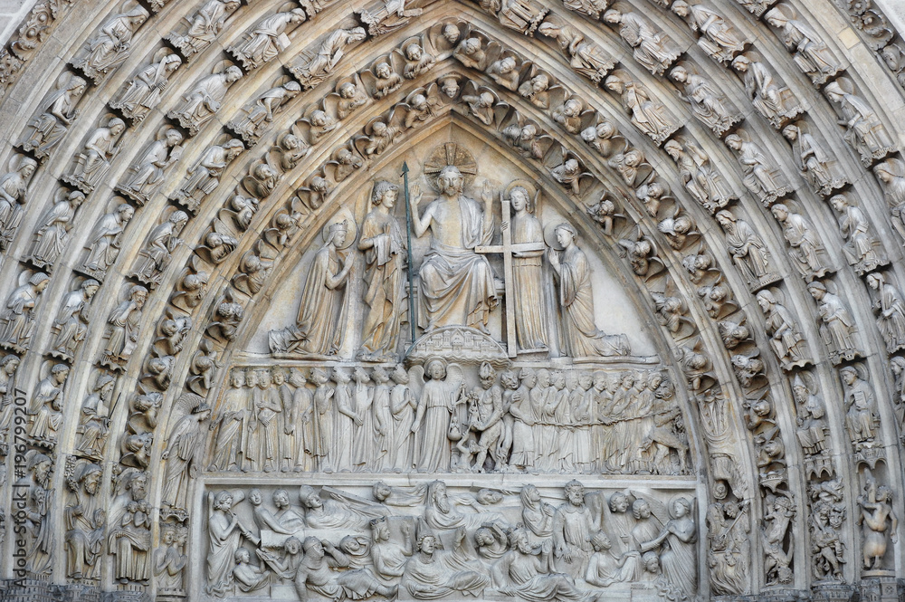 Detail of the facade of Notre Dame cathedral. France. Paris. Architecture of France.