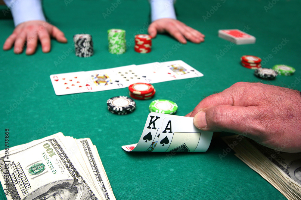 Card player checks hand Card player checks hand