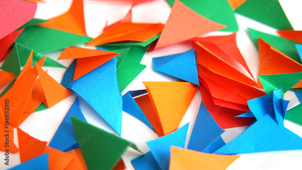 the multi-colored leaflets which are cut out from paper, colourful background, collage the multi-colored leaflets which are cut out from paper, colourful background, collage